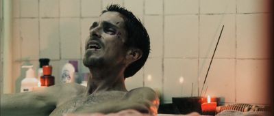Still from The Machinist (2004) that has been tagged with: candlelight