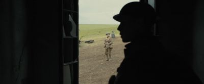 Still from 1917 (2019) that has been tagged with: over-the-shoulder & silhouette