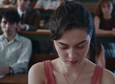 Still from Happening (2021) that has been tagged with: looking down & classroom