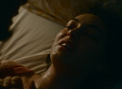 Still from Happening (2021) that has been tagged with: laying down & bed & overhead