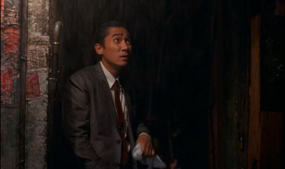 Still from In the Mood For Love (2000) that has been tagged with: exterior & rain
