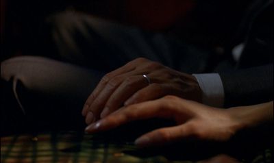 Still from In the Mood For Love (2000) that has been tagged with: extreme close-up & romantic