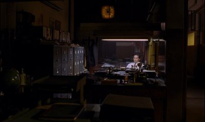 Still from In the Mood For Love (2000) that has been tagged with: fluorescent light & office