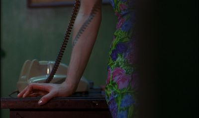 Still from In the Mood For Love (2000) that has been tagged with: phone
