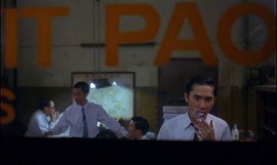 Still from In the Mood For Love (2000) that has been tagged with: group-shot & office