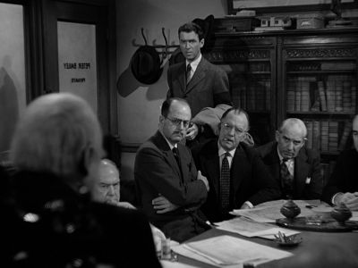Still from It's A Wonderful Life (1946) that has been tagged with: group-shot & office