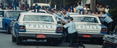 Still from Judas and the Black Messiah (2021) that has been tagged with: crowd & police car