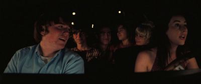 Still from Licorice Pizza (2021) that has been tagged with: backseat & group-shot