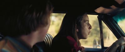 Still from Licorice Pizza (2021) that has been tagged with: driving & profile shot & interior