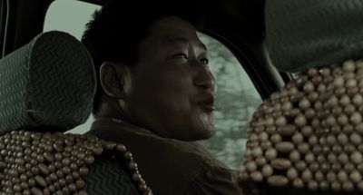 Still from Memories of Murder (2003) that has been tagged with: medium close-up & backseat