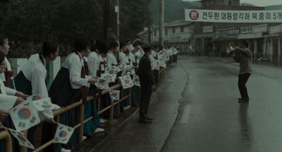 Still from Memories of Murder (2003) that has been tagged with: rain & megaphone