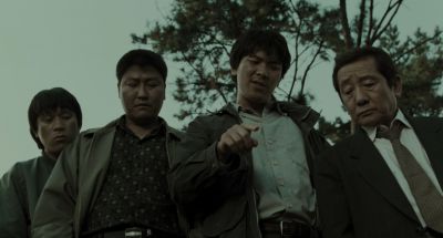 Still from Memories of Murder (2003) that has been tagged with: looking down & pointing