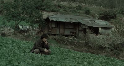 Still from Memories of Murder (2003) that has been tagged with: squatting & wide shot