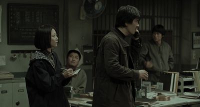 Still from Memories of Murder (2003) that has been tagged with: phone & office