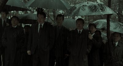 Still from Memories of Murder (2003) that has been tagged with: medium wide & rain