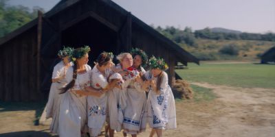 Still from Midsommar (2019) that has been tagged with: group-shot & crying