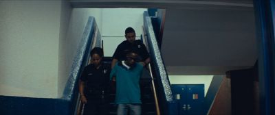 Still from Moonlight (2016) that has been tagged with: three-shot & stairs
