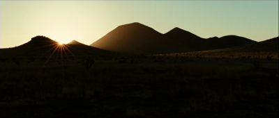 Still from No Country For Old Men (2007) that has been tagged with: sunset & mountains