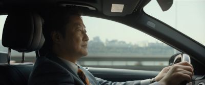 Still from Parasite (2019) that has been tagged with: driving & profile shot & clean single