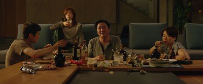 Still from Parasite (2019) that has been tagged with: group-shot & drinking