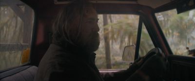 Still from Pig (2021) that has been tagged with: driving & profile shot & interior