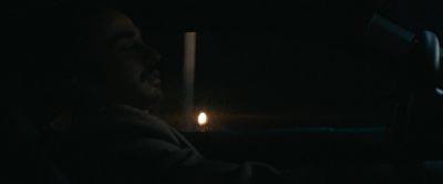 Still from Pig (2021) that has been tagged with: driving & profile shot