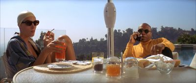 Still from Pulp Fiction (1994) that has been tagged with: phone & medium wide