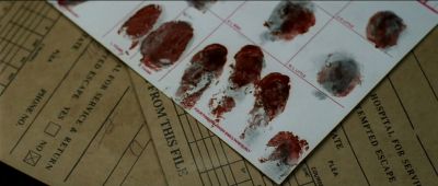 Still from Se7en (1995) that has been tagged with: extreme close-up & blood