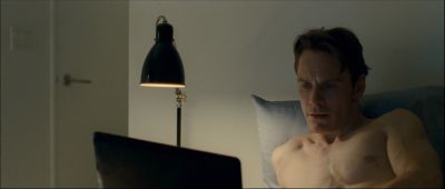 Still from Shame (2011) that has been tagged with: bedroom & laptop