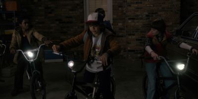 Still from TV Show: Netflix — "Stranger Things: Season 1 - Episode 1" that has been tagged with: children & three-shot