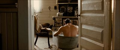 Still from The Assassination Of Jesse James By The Coward Robert Ford (2007) that has been tagged with: over-the-shoulder & bathroom
