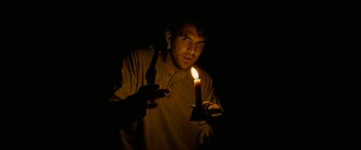 Still from The Assassination Of Jesse James By The Coward Robert Ford (2007) that has been tagged with: candlelight & gun