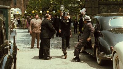 Still from The Godfather (1972) that has been tagged with: group-shot & parking lot