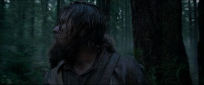 Still from The Revenant (2015) that has been tagged with: looking back & forest