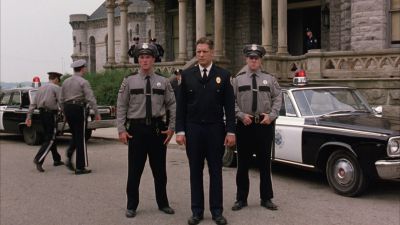 Still from The Shawshank Redemption (1994) that has been tagged with: three-shot & police car