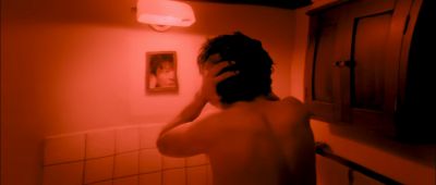 Still from Thirst (2009) that has been tagged with: over-the-shoulder & bathroom