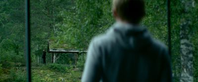 Still from Ex Machina (2014) that has been tagged with: over-the-shoulder & forest