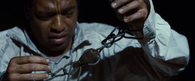 Still from 12 Years a Slave (2013) that has been tagged with: clean single & night & chain & handcuffs