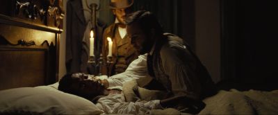 Still from 12 Years a Slave (2013) that has been tagged with: profile shot & night & interior & bedroom