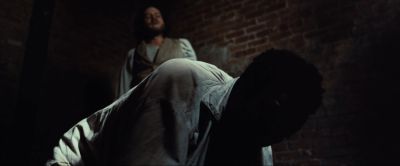 Still from 12 Years a Slave (2013) that has been tagged with: 0f0f0f & brick wall