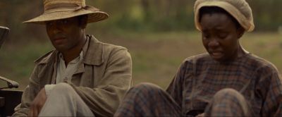 Still from 12 Years a Slave (2013) that has been tagged with: medium shot & exterior & sitting & day