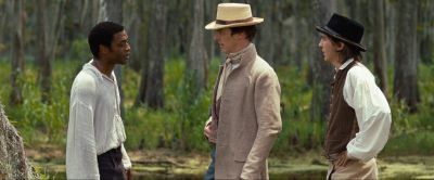 Still from 12 Years a Slave (2013) that has been tagged with: medium wide & forest & three-shot