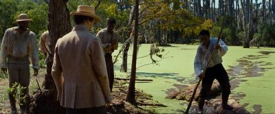 Still from 12 Years a Slave (2013) that has been tagged with: over-the-shoulder & group-shot & medium wide & exterior