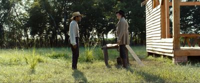 Still from 12 Years a Slave (2013) that has been tagged with: wide shot & grass & two-shot & day