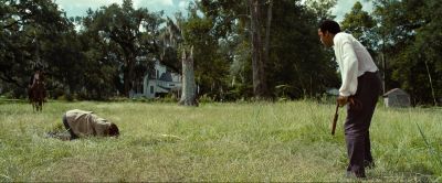 Still from 12 Years a Slave (2013) that has been tagged with: grass & over-the-shoulder