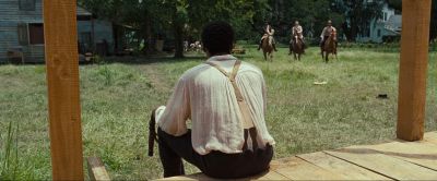 Still from 12 Years a Slave (2013) that has been tagged with: exterior & horses & over-the-shoulder & day