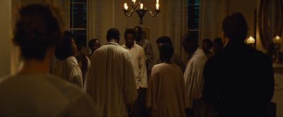 Still from 12 Years a Slave (2013) that has been tagged with: night & interior & group-shot & medium wide