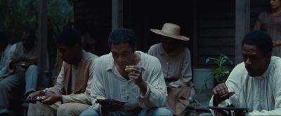 Still from 12 Years a Slave (2013) that has been tagged with: medium shot & group-shot & eating