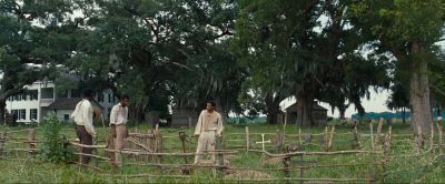 Still from 12 Years a Slave (2013) that has been tagged with: trees & exterior & day & three-shot