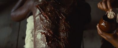 Still from 12 Years a Slave (2013) that has been tagged with: blood & medium close-up & gore & first aid